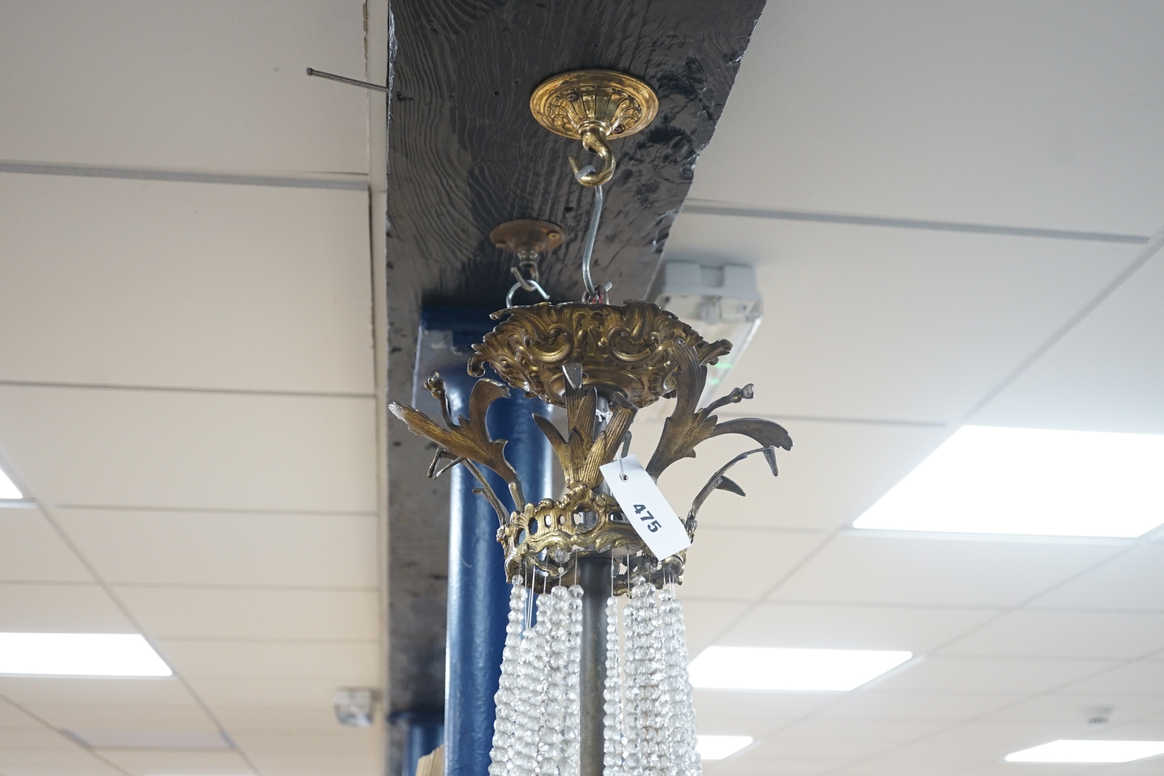 A French gilt Empire style cut glass and brass chandelier, 95cm high